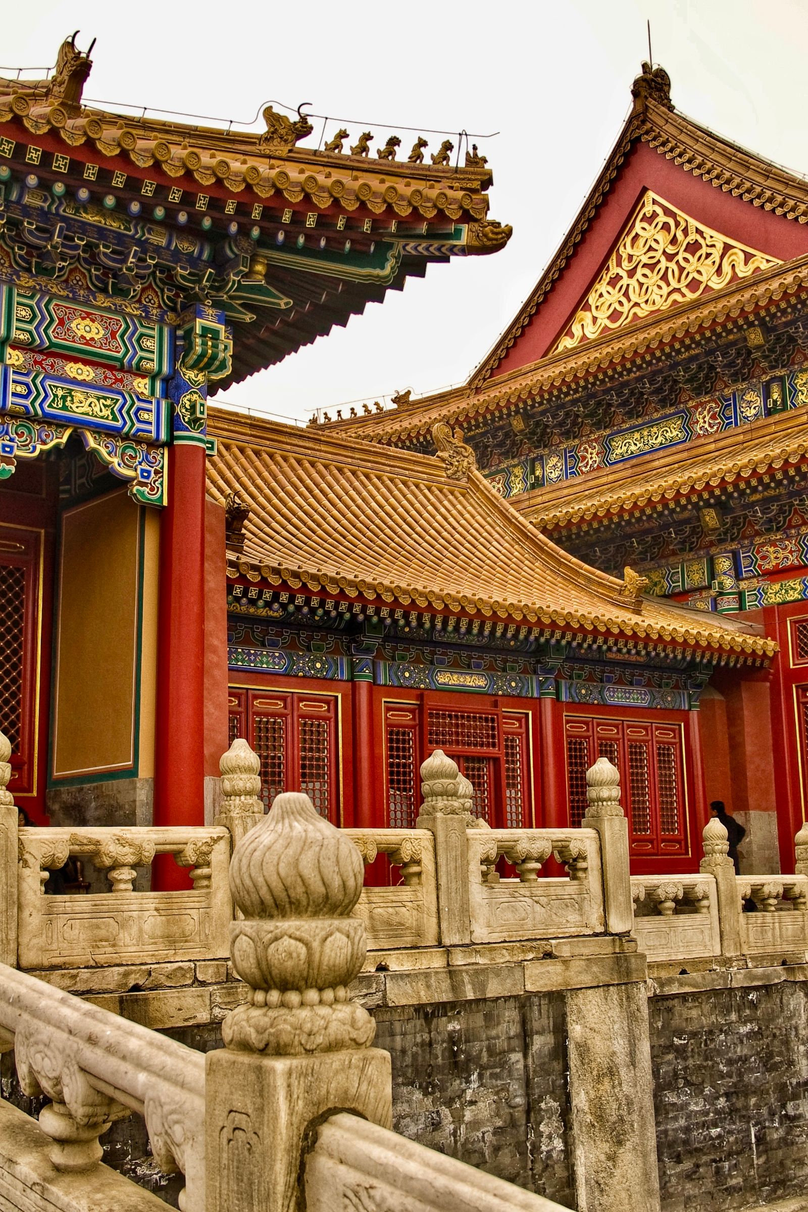 Layered golden roofs, red columns and intricate blue-green painted eaves in Beijing's Forbidden City